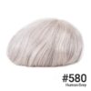 A white wig with some gray hair on top of it