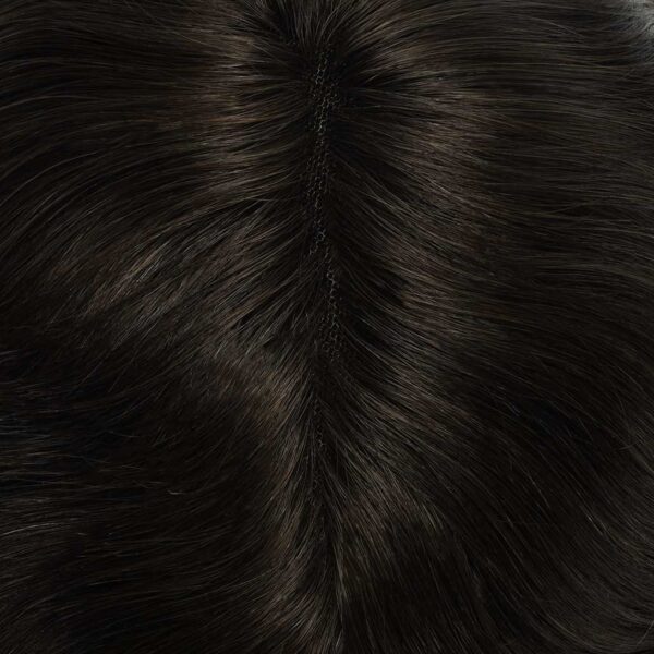 A close up of the fur on a black cat.