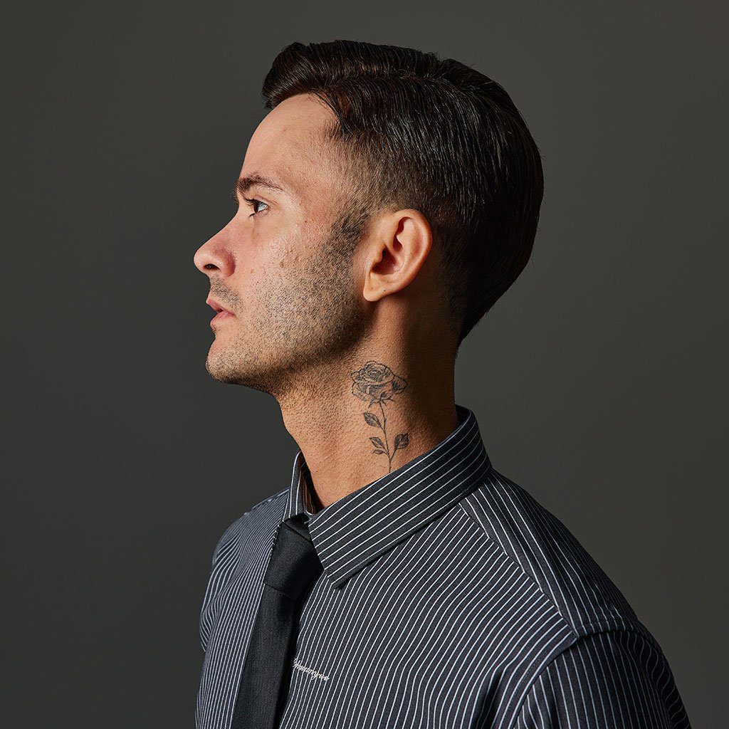 A man with a neck tie and beard.
