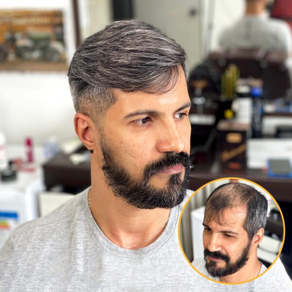 A man with a beard and mustache in front of another man.