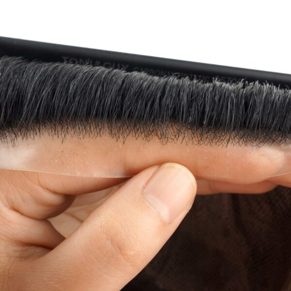 A person is holding their hair in the comb.