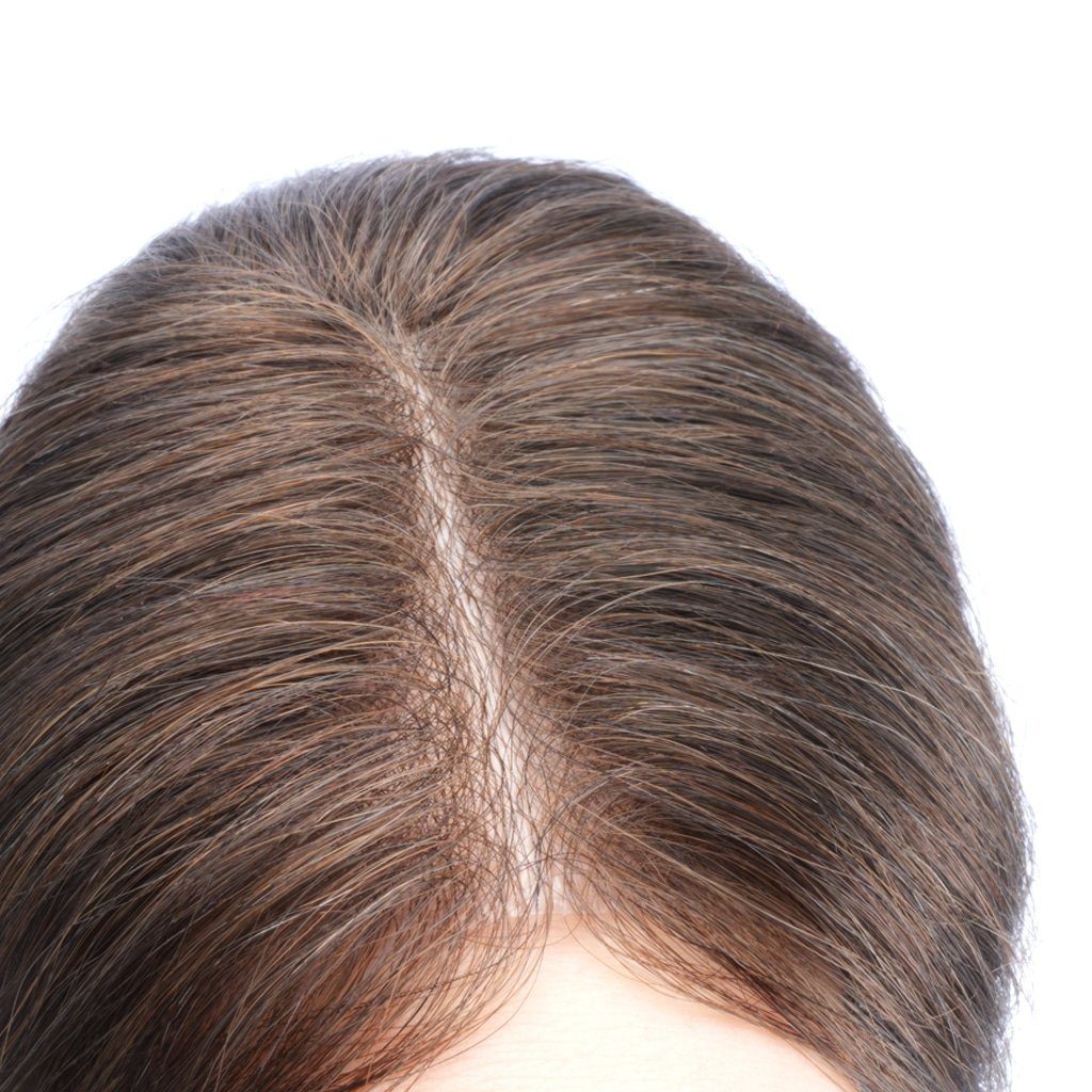 A close up of the back of a woman 's head