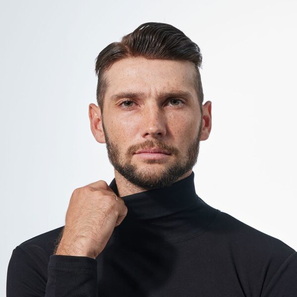 A man in black shirt holding his chin.