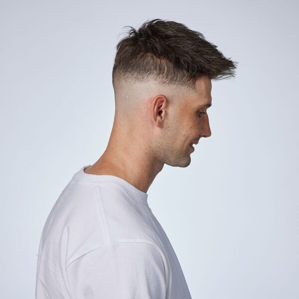 A man with a white shirt and a short haircut