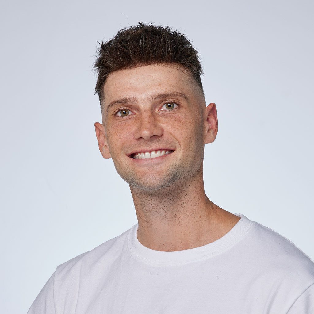 A man with a white shirt and black hair